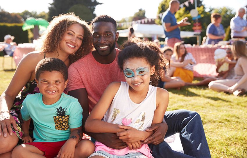 Diverse family having fun at a children's carnival