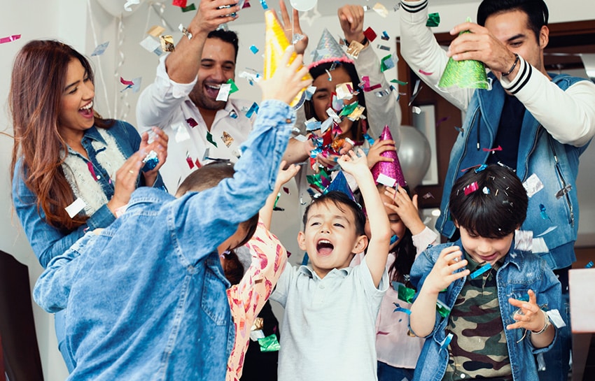 Family celebrating New Year's Eve with young children