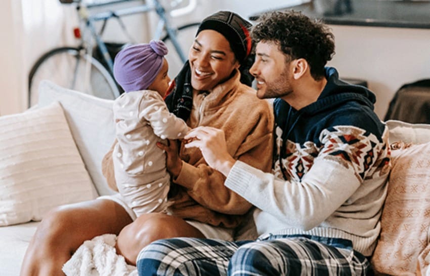 Mother and Father Looking At Daughter