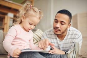 Daughter and Father Reading Together