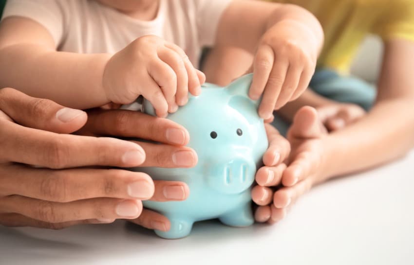 family holding piggy bank