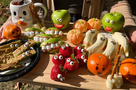 Healthy Halloween party snacks displayed on a charcuterie board